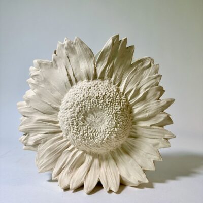 Unglazed Sunflower Vase with a Jaleh Green interior.