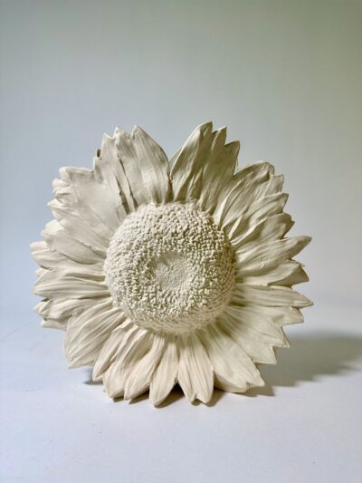 Unglazed Sunflower Vase with a Jaleh Green interior.